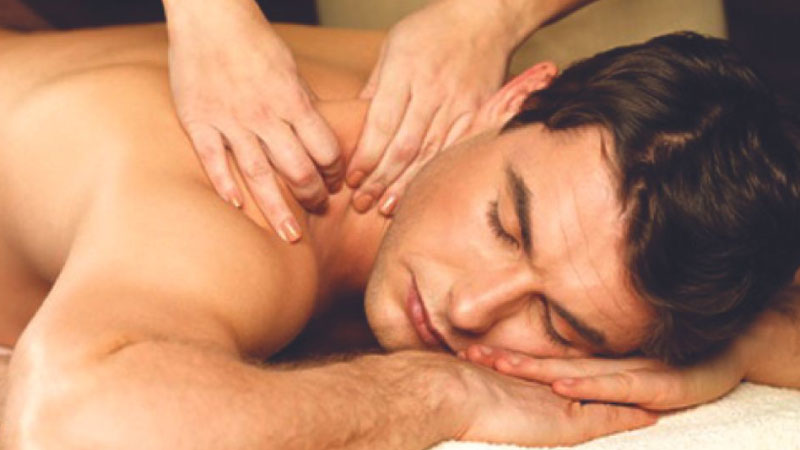 Male getting back massage at HCL Healing Center